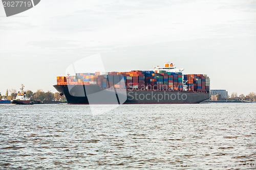 Image of Fully laden container ship in port