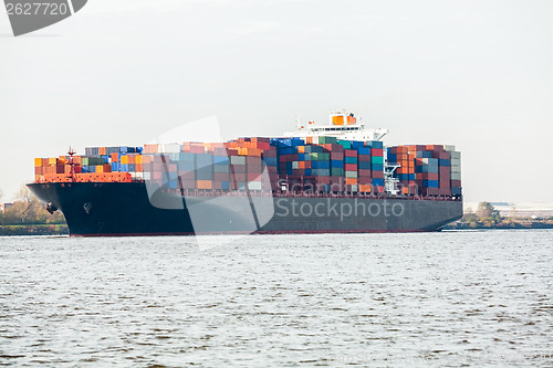 Image of Fully laden container ship in port