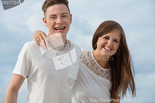 Image of smiling young couple having fun in summer holiday