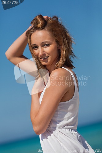 Image of beautiful happy woman on the beach lifestyle summertime