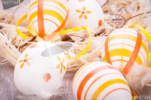 Image of Decorative Easter eggs, on a rustic wooden table