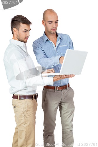 Image of Two businessmen consulting a laptop