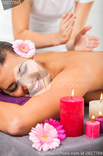 Image of Beautiful woman having a back massage
