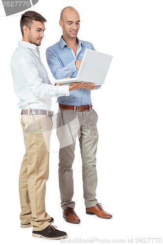 Image of Two businessmen consulting a laptop