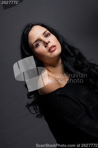 Image of Dark moody portrait of a brunette beauty