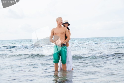 Image of smiling young couple having fun in summer holiday