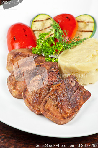 Image of tongue with grilled vegetable