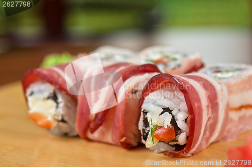 Image of Sushi roll with bacon