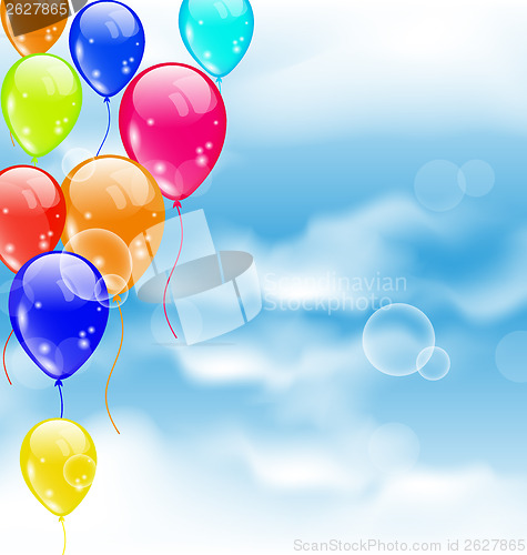 Image of Flying colourful balloons in blue sky