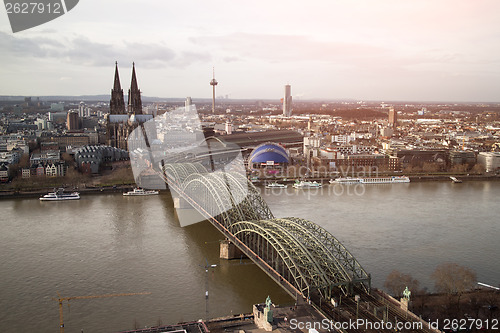 Image of View of Koeln, Germany. Gothic cathedral and steel bridge over r