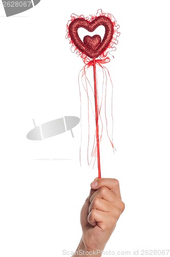 Image of Hand with heart on a stick