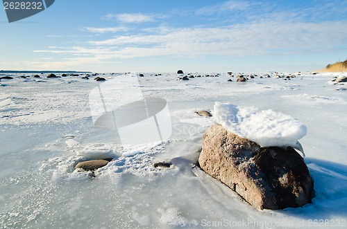 Image of  Stones in the ice on the Baltic Sea coast