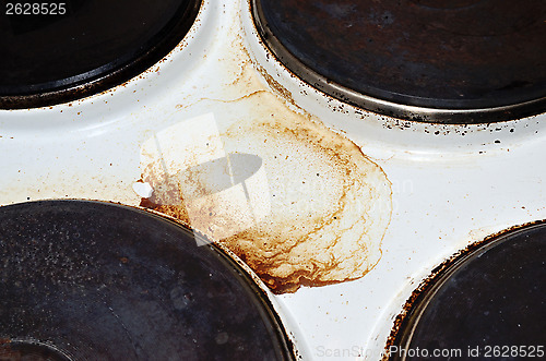 Image of old white enamelled dirty electric cooker