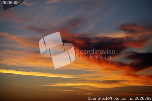 Image of Fiery sunrise sky on summer sea