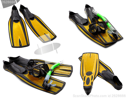 Image of Set of yellow flippers, mask, snorkel for diving with water drop