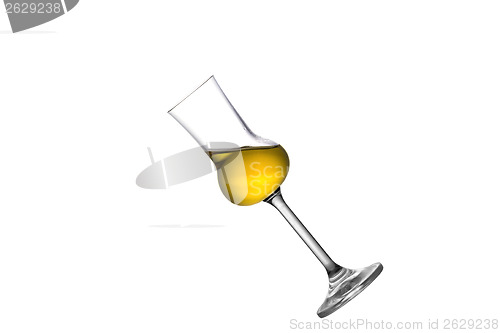 Image of A tilted grappa glass