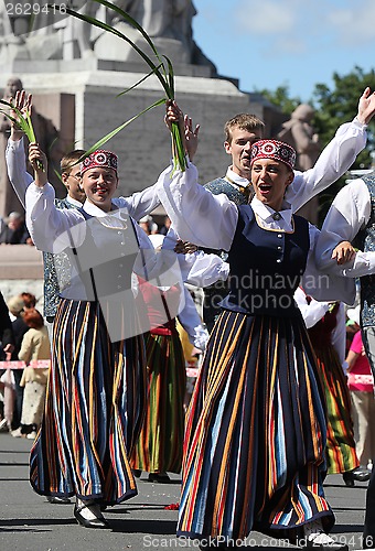 Image of RIGA, LATVIA - JULY 06: People in national costumes at the Latvi