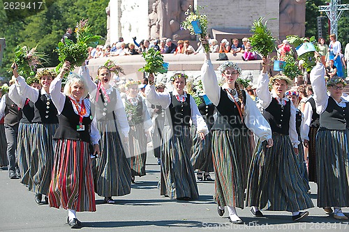 Image of RIGA, LATVIA - JULY 07: People in national costumes at the Latvi