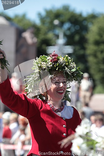 Image of RIGA, LATVIA - JULY 07: People in national costumes at the Latvi