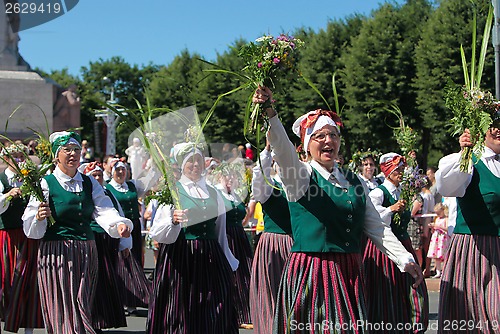 Image of RIGA, LATVIA - JULY 07: People in national costumes at the Latvi