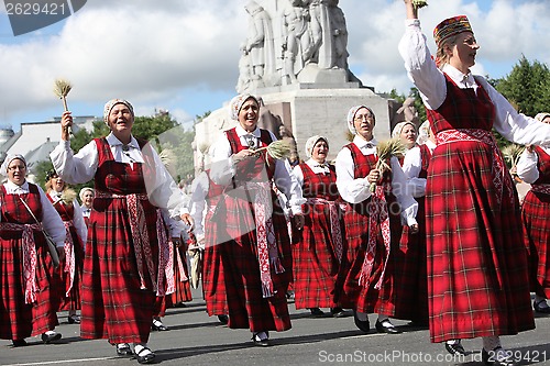 Image of RIGA, LATVIA - JULY 07: People in national costumes at the Latvi