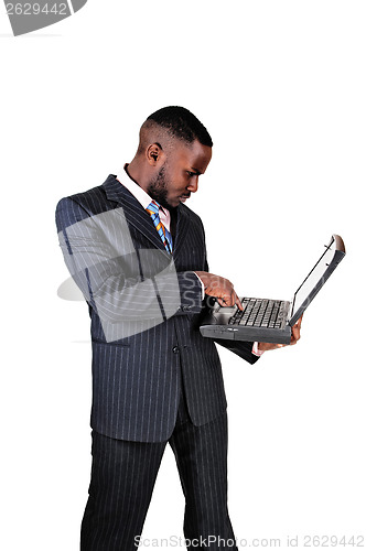 Image of Black man with laptop.