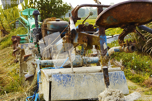 Image of tractor on rice farm