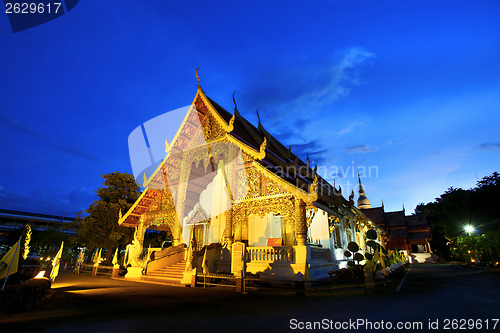 Image of Wat Phra Singh temple at sunset in Chiang Mai, Thailand. 