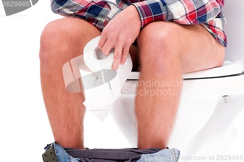 Image of Man on toilet bowl