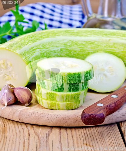 Image of Zucchini green with garlic on a board