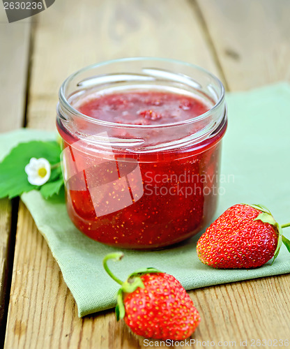 Image of Jam of strawberry with berries on a board