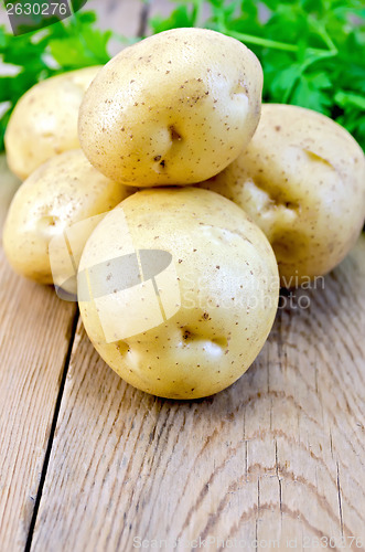 Image of Potatoes yellow with parsley on the board