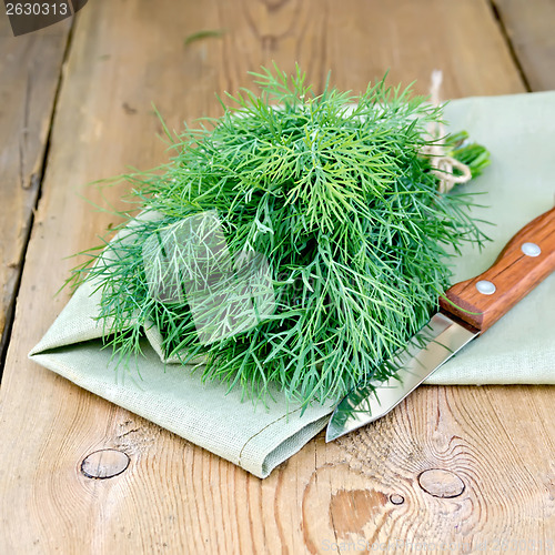 Image of Dill with a knife on board