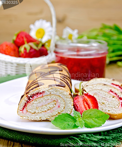 Image of Roulade with strawberries and daisies on a board