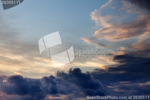 Image of Dark clouds at sunset