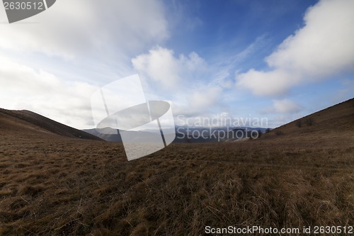 Image of Steppe mountains and blue sky with clouds