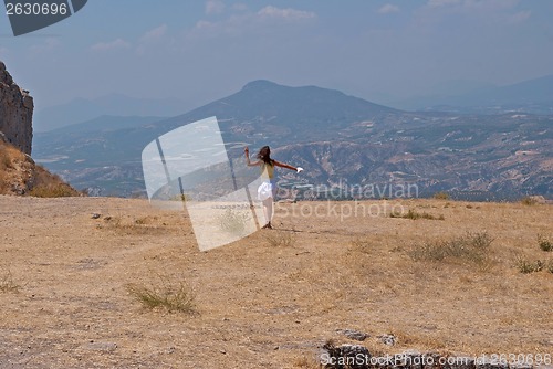 Image of Girl and mountains.