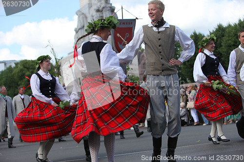 Image of RIGA, LATVIA - JULY 07: People in national costumes at the Latvi