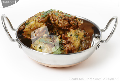 Image of Onion bhajis in a kadai side view