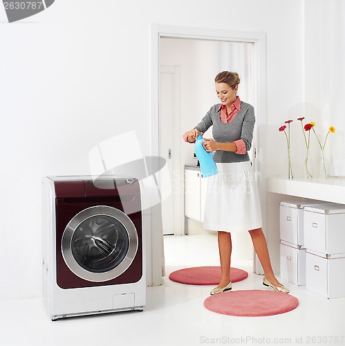 Image of woman doing a housework holding presoak 