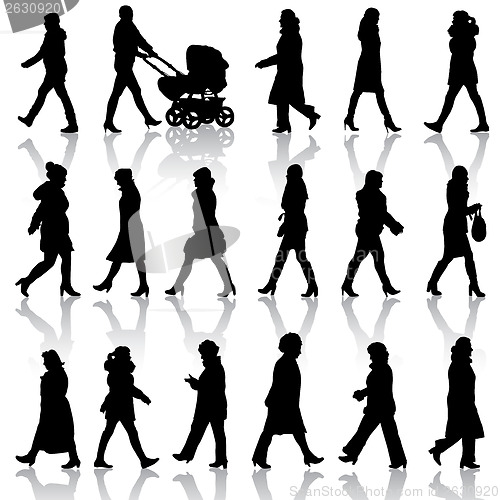 Image of Black silhouettes of beautiful womans on white background. Vecto