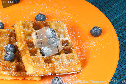 Image of Waffle with syrup and fresh blueberries