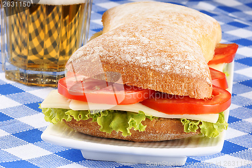 Image of Italian panino sandwich and beer