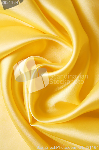 Image of Smooth elegant golden silk as background 