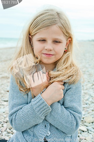 Image of girl at the autumn beach 