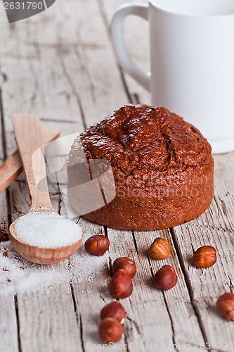 Image of fresh baked browny cake, milk, sugar, hazelnuts