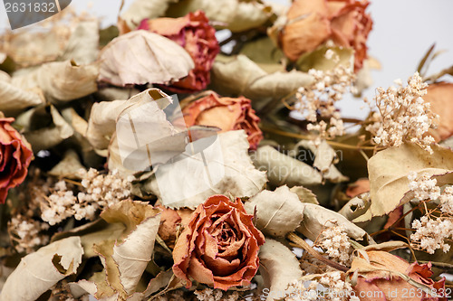 Image of bouquet of dried roses with leaves