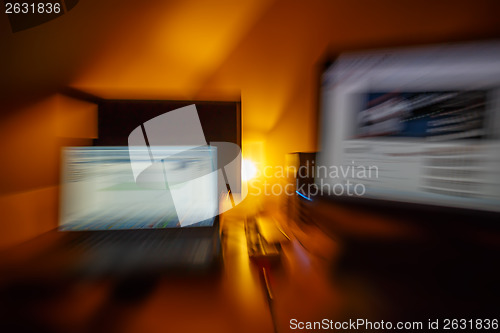 Image of abstract blurry computer workstation