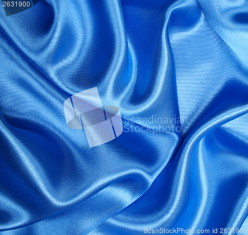 Image of Smooth elegant blue silk as background 