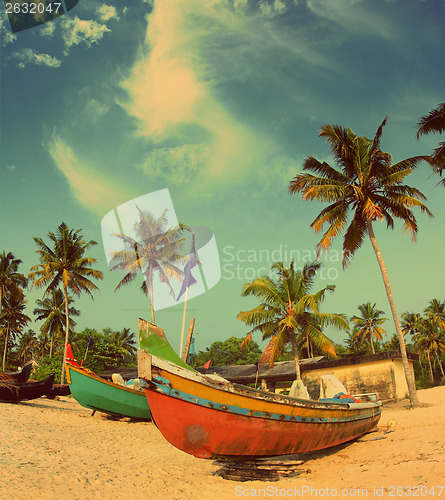 Image of old fishing boats on beach - vintage retro style